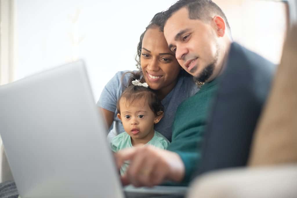 Family worshipping online with their child