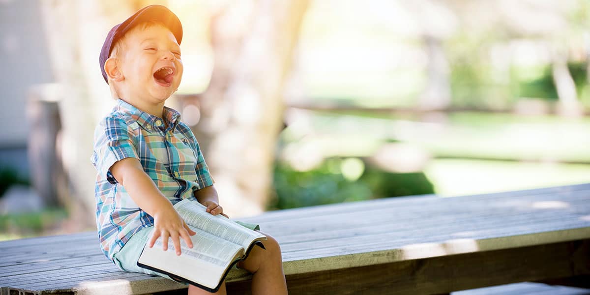 Laughing Boy With Bible