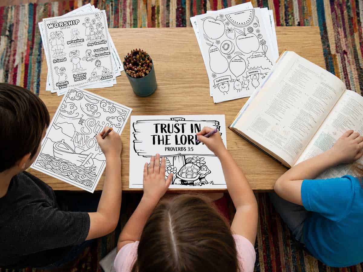 Children coloring printable Bible coloring pages during family devotion time